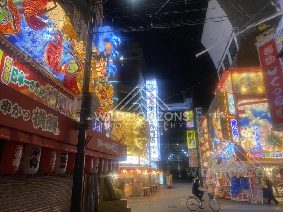 Illuminated street decorations and stalls in Osaka at night. Dotonbori, Osaka, Japan.
