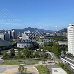 City skyline with a river corridor cutting through the urban landscape. Hiroshima, Japan.