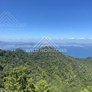Sweeping coastal panorama from a high mountain lookout over Miyajima. Miyajima, Hiroshima, Japan.