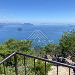 Lookout viewpoint overlooking blue bay and scattered islands. Miyajima, Hiroshima, Japan.