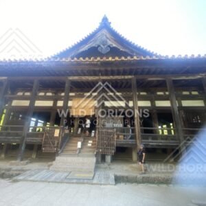 Wooden temple hall with tiled roof and raised veranda. Miyajima, Hiroshima, Japan.