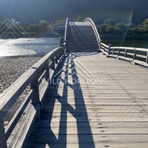 Perspective along the wooden deck of the Kintaikyo Bridge. Iwakuni, Yamaguchi, Japan.