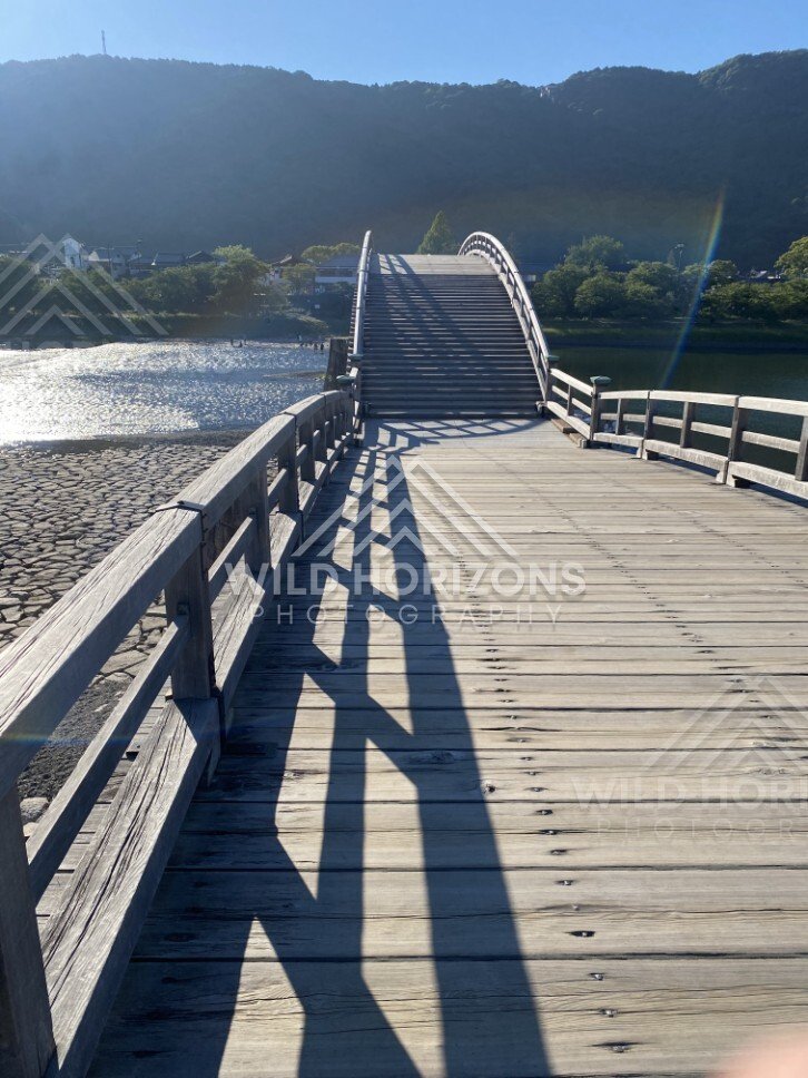 Perspective along the wooden deck of the Kintaikyo Bridge. Iwakuni, Yamaguchi, Japan.