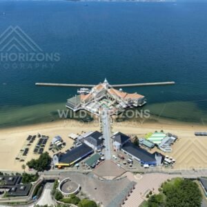 Top-down view of seaside building extending into the water. Fukuoka, Japan.