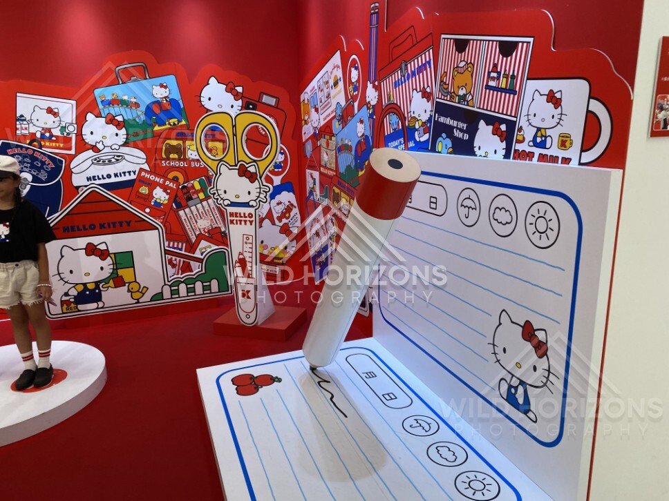 Oversized Hello Kitty writing display with giant pen and notebook backdrop. Fukuoka, Japan.