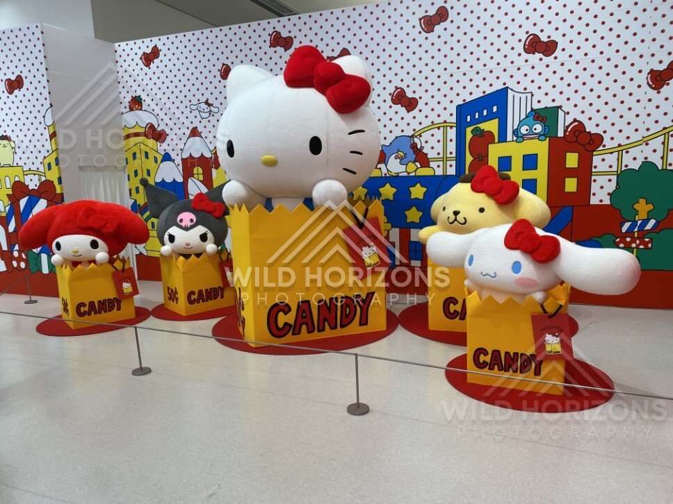 Hello Kitty and friends character statues popping out of candy boxes in an exhibit. Fukuoka, Japan.