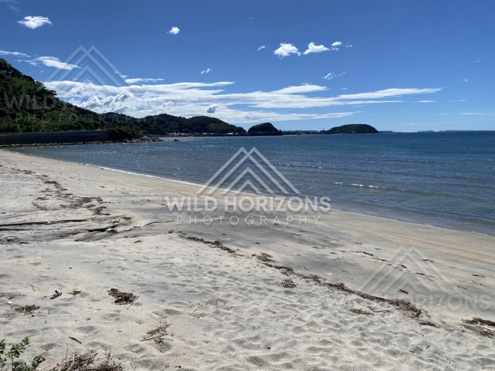 Calm Coastal Waters and Sand Flats at Nijinomatsubara. Karatsu, Japan.