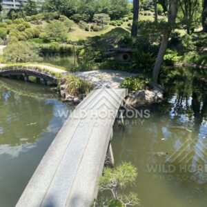 Stone Bridges Over Still Water in Shukkeien Garden. Hiroshima, Japan.