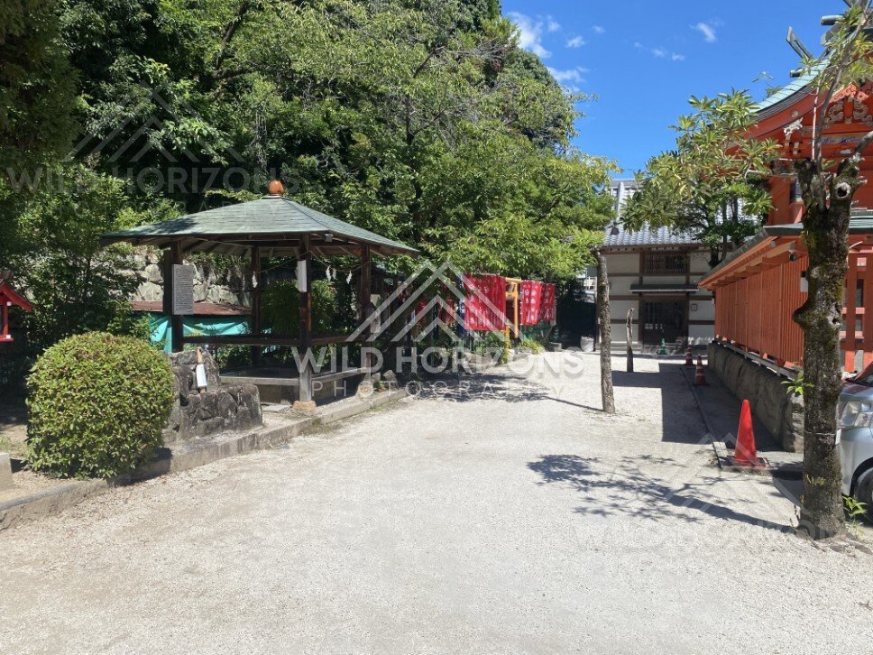 Shrine Courtyard with Red Banners at Kinko Inari Shrine. Hiroshima, Japan.