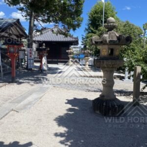 Stone Lanterns in the Courtyard of Kinko Inari Shrine. Hiroshima, Japan.