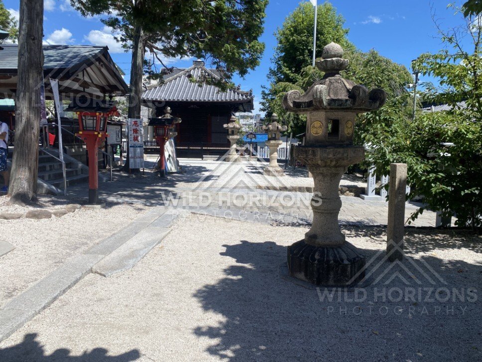 Stone Lanterns in the Courtyard of Kinko Inari Shrine. Hiroshima, Japan.