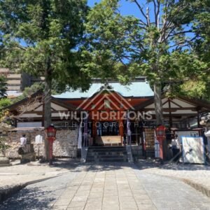 Main Hall of Kinko Inari Shrine Framed by Trees. Hiroshima, Japan.