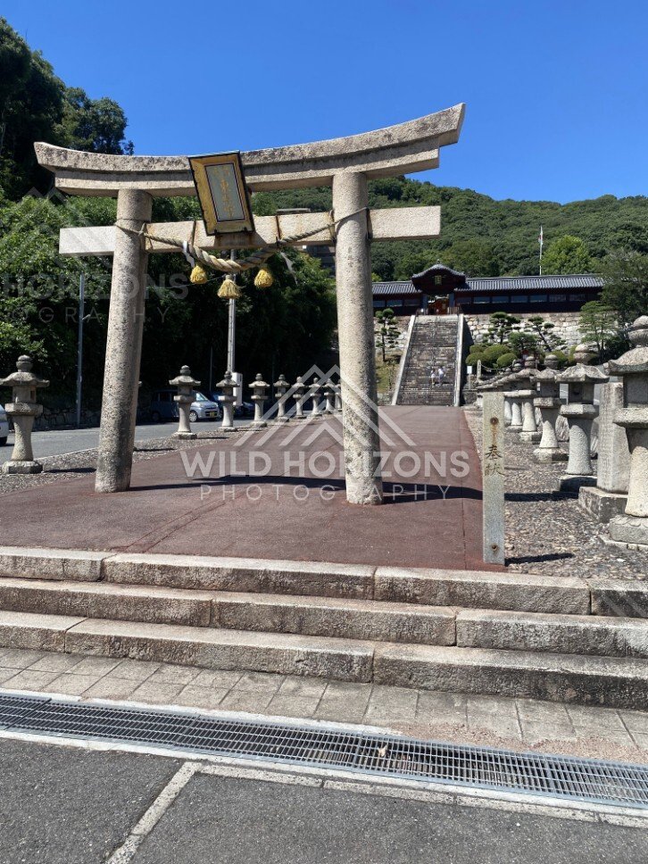 Torii Gate and Lantern-Lined Steps at Kinko Inari Shrine. Hiroshima, Japan.