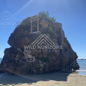 Benten-jima Rock Island with Shrine and Sun Flare. Izumo, Japan.