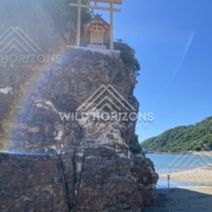 Torii Gate and Small Shrine Perched on a Sea Cliff. Izumo, Japan.