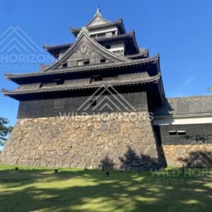 Low-Angle View of Matsue Castle Stone Base and Timber Walls. Matsue, Japan.
