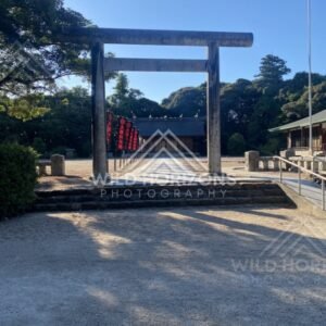 Stone Torii Gate and Shrine Approach with Red Banners. Matsue, Japan.