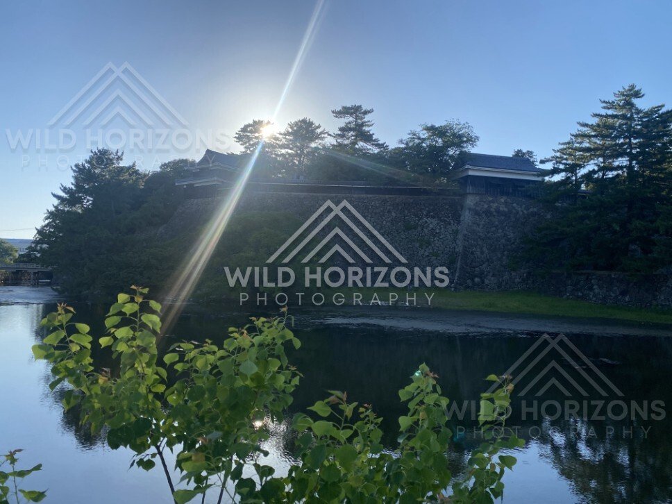 Sunbeam Over the Moat and Stone Walls of Matsue Castle. Matsue, Japan.