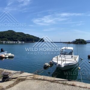 Small Fishing Boat Moored in a Calm Harbor Lagoon. Shimane, Japan.