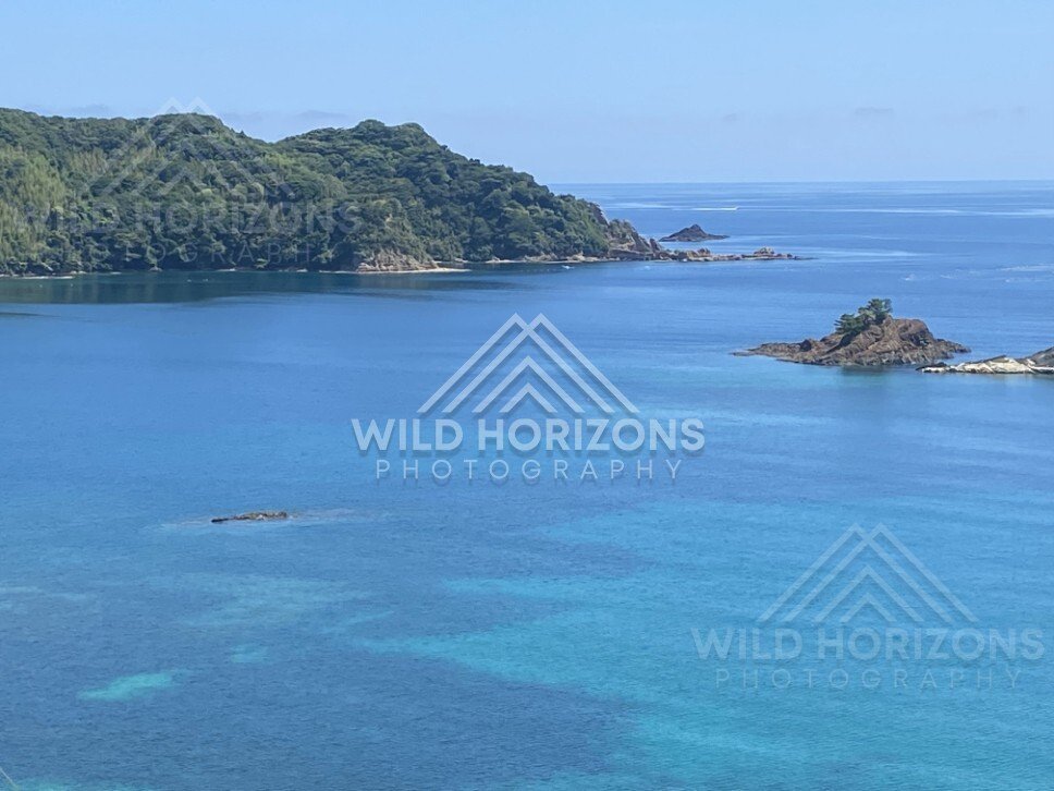 Rocky Islets and Shallow Reefs in Clear Blue Water. Shimane, Japan.