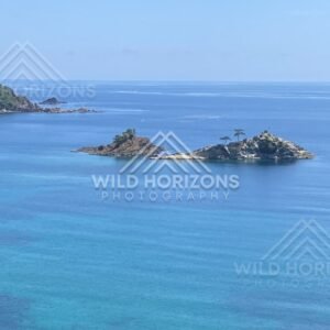 Two Tree-Topped Islets in a Bright Blue Sea. Shimane, Japan.