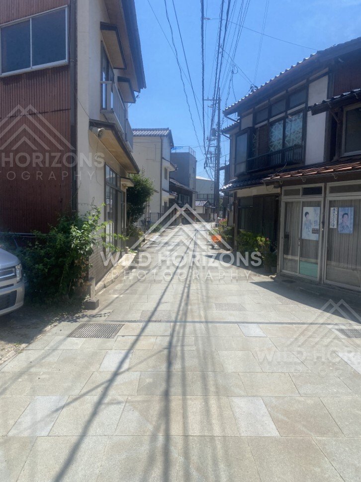 Narrow Lane Lined With Traditional Buildings and Overhead Cables. Mihonoseki, Japan.