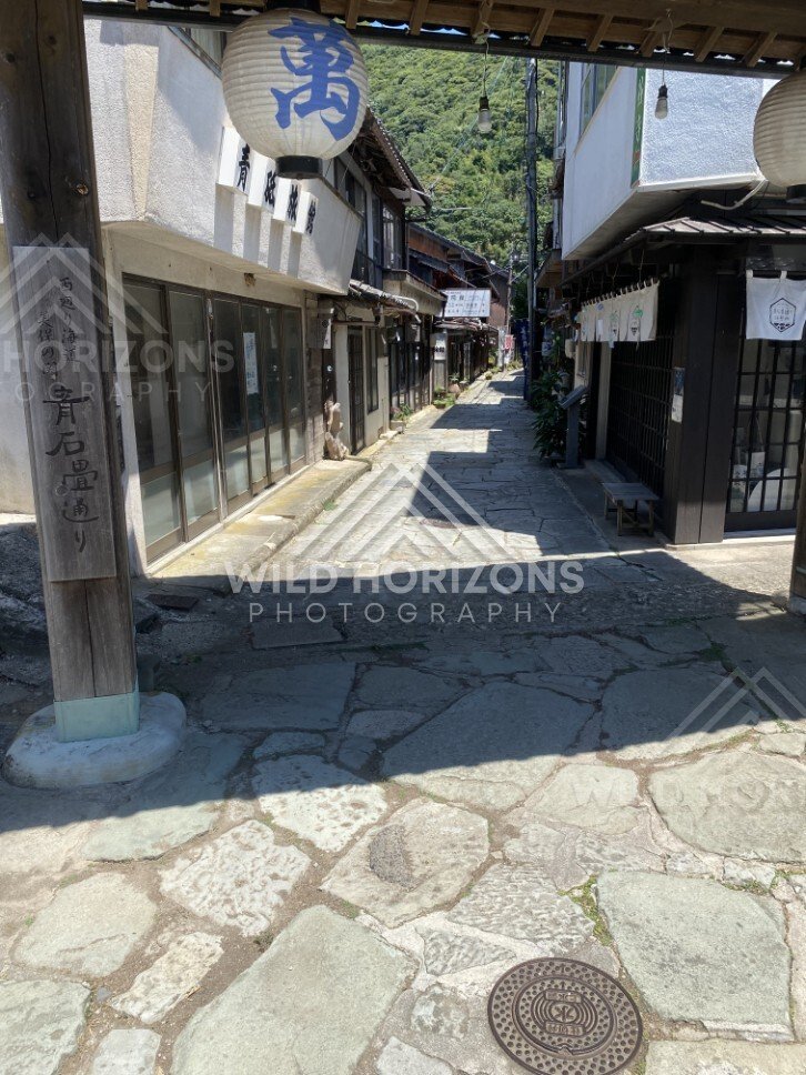 Stone-Paved Shopping Street With Hanging Lanterns. Mihonoseki, Japan.