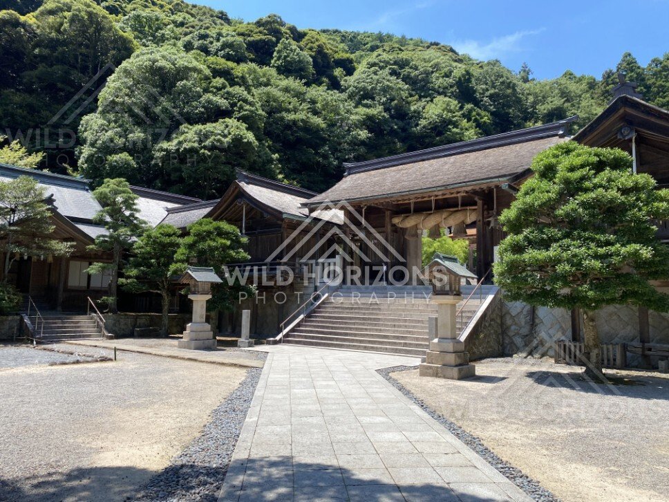 Miho Shrine Hall With Wide Steps and Forested Hillside Backdrop. Mihonoseki, Japan.