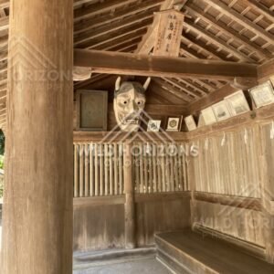 Wooden Shelter Displaying a Traditional Oni Mask. Mihonoseki, Japan.