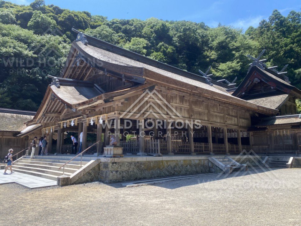 Main Shrine Hall With Thatched Roof and Visitors on the Steps. Mihonoseki, Japan.