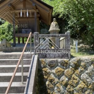 Small Hillside Shrine Above a Mossy Stone Retaining Wall. Mihonoseki, Japan.