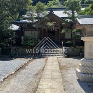 Stone Path Leading to a Shrine Entrance Through a Gravel Courtyard. Mihonoseki, Japan.