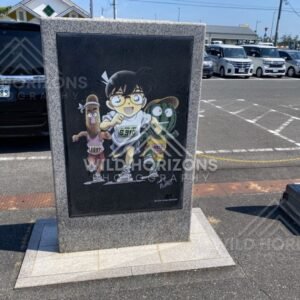 Detective Conan character art panel in the Gosho Aoyama Manga Factory car park. Hokuei, Japan.