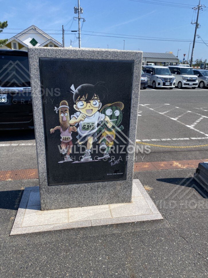 Detective Conan character art panel in the Gosho Aoyama Manga Factory car park. Hokuei, Japan.