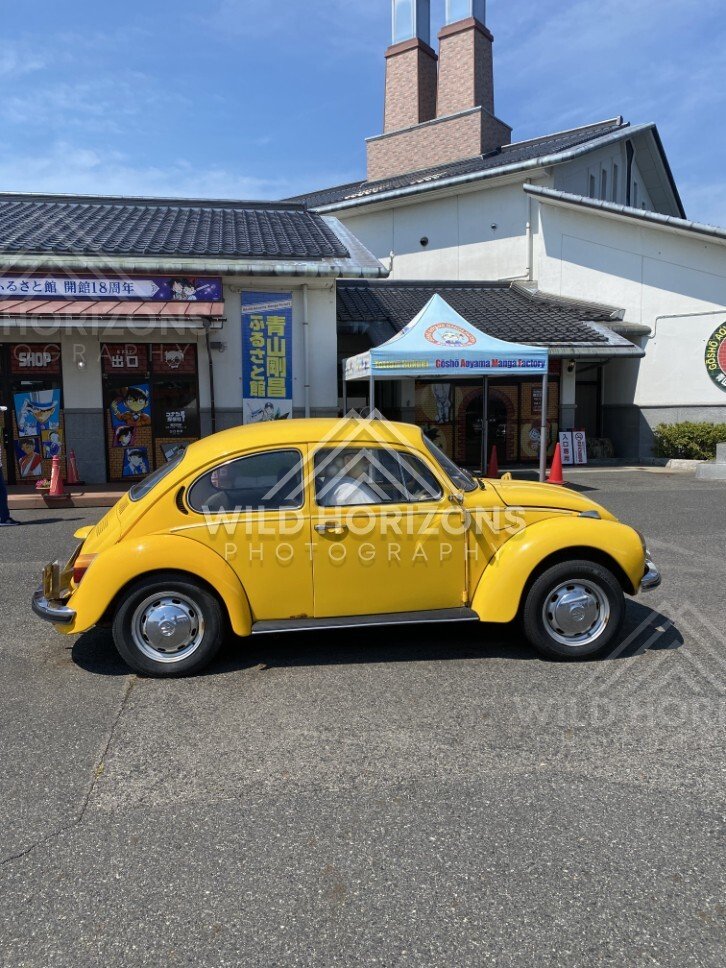 Yellow Beetle outside the Gosho Aoyama Manga Factory entrance. Hokuei, Japan.