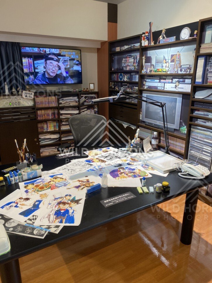 Recreated manga artist studio desk exhibit at the Gosho Aoyama Manga Factory. Hokuei, Japan.