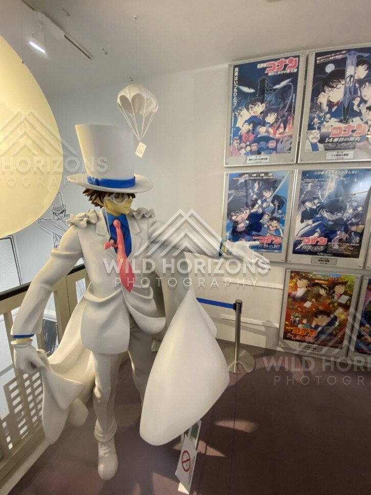 Kaitou Kid statue beside Detective Conan posters inside the Gosho Aoyama Manga Factory. Hokuei, Japan.