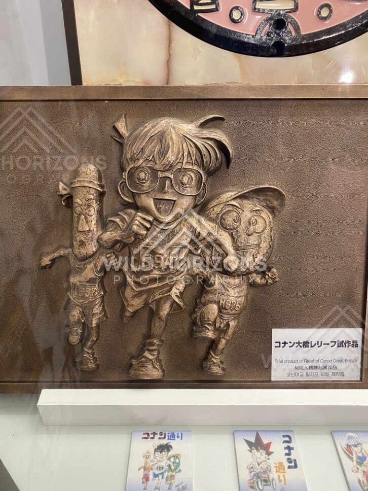 Bronze relief panel of Detective Conan characters at the Gosho Aoyama Manga Factory. Hokuei, Japan.