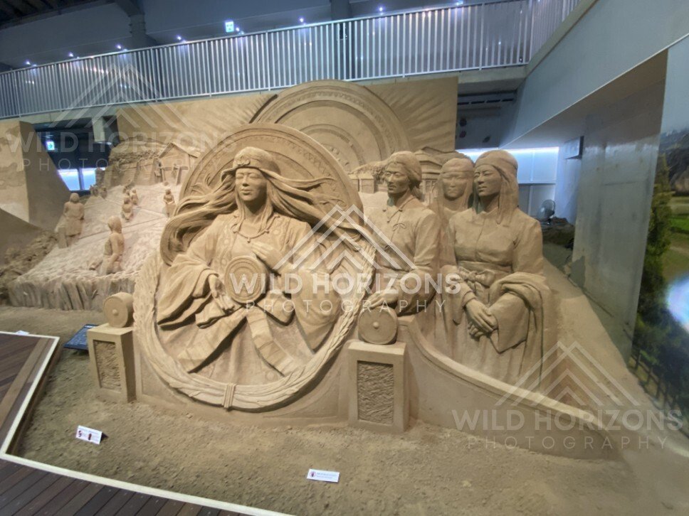 Detailed Sand Sculpture of Figures and Circular Relief Panels at Tottori Sand Museum. Tottori, Japan.