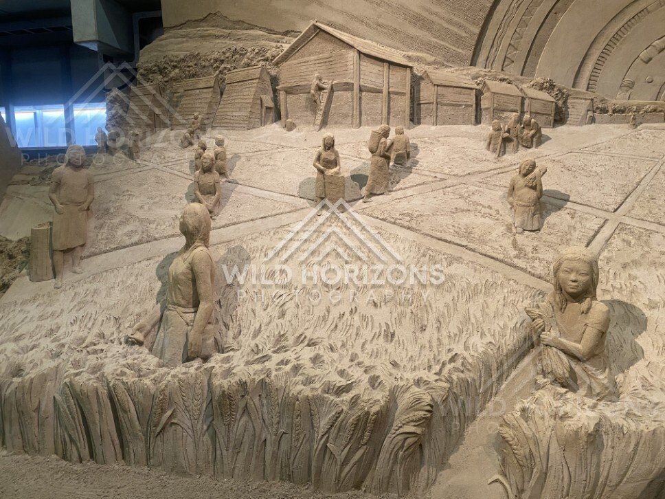 Wide Sand Sculpture Scene of Village and Rice Fields at Tottori Sand Museum. Tottori, Japan.