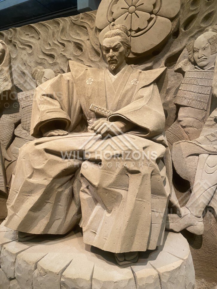 Close-Up Sand Sculpture of Seated Noble Holding Fan. Tottori Sand Museum, Japan.