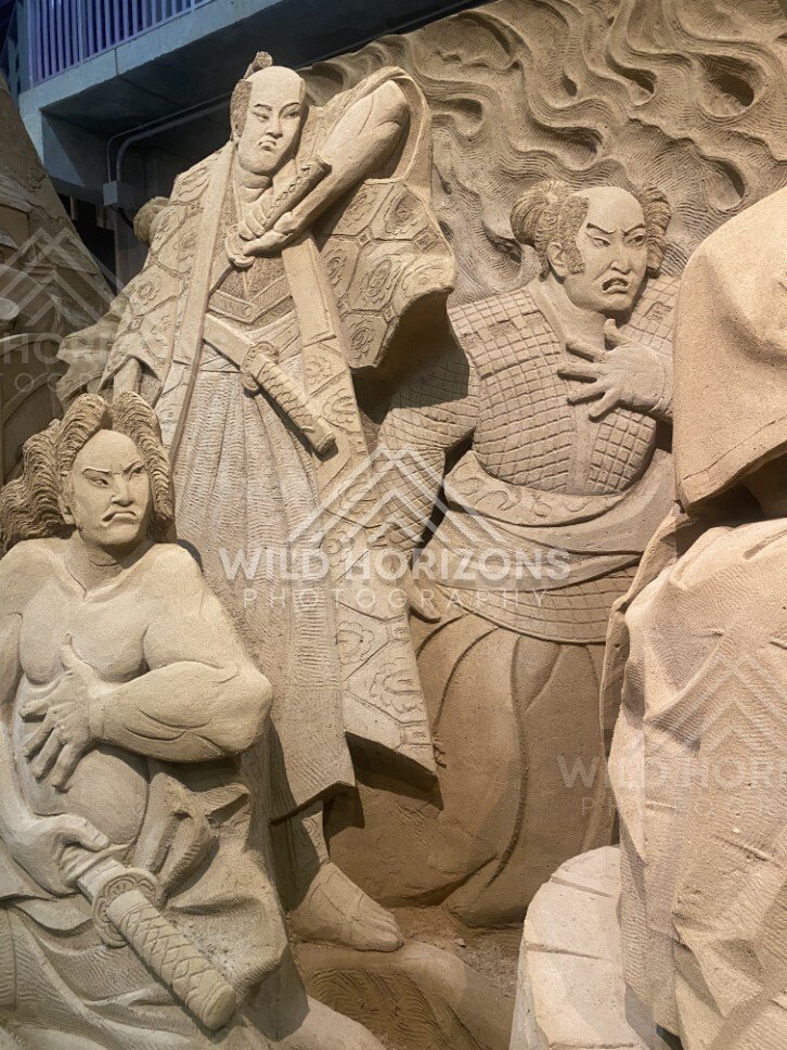 Sand Sculpture of Samurai Warrior with Spear and Attendants. Tottori Sand Museum, Japan.