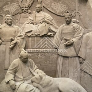 Sand Sculpture Panel of Seated Figures and Resting Dog. Tottori Sand Museum, Japan.