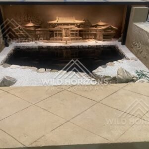 Indoor Reflecting Pool with Illuminated Temple Sand Sculpture. Tottori Sand Museum, Japan.