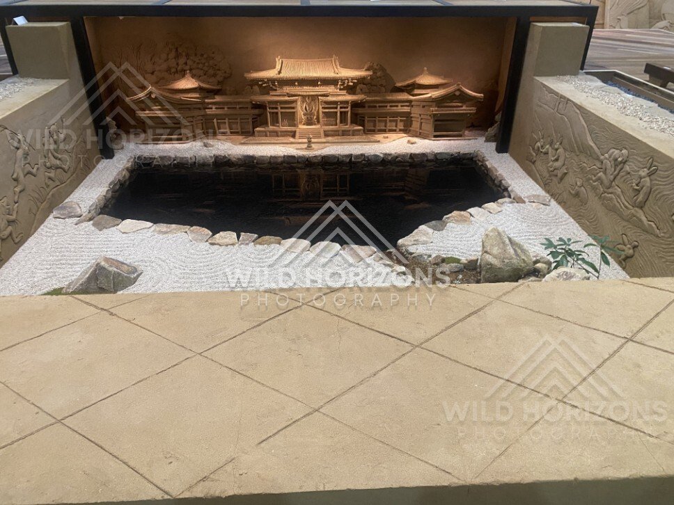 Indoor Reflecting Pool with Illuminated Temple Sand Sculpture. Tottori Sand Museum, Japan.