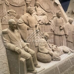 Sand Sculpture Crowd Scene with Temple Roof in Background. Tottori Sand Museum, Japan.