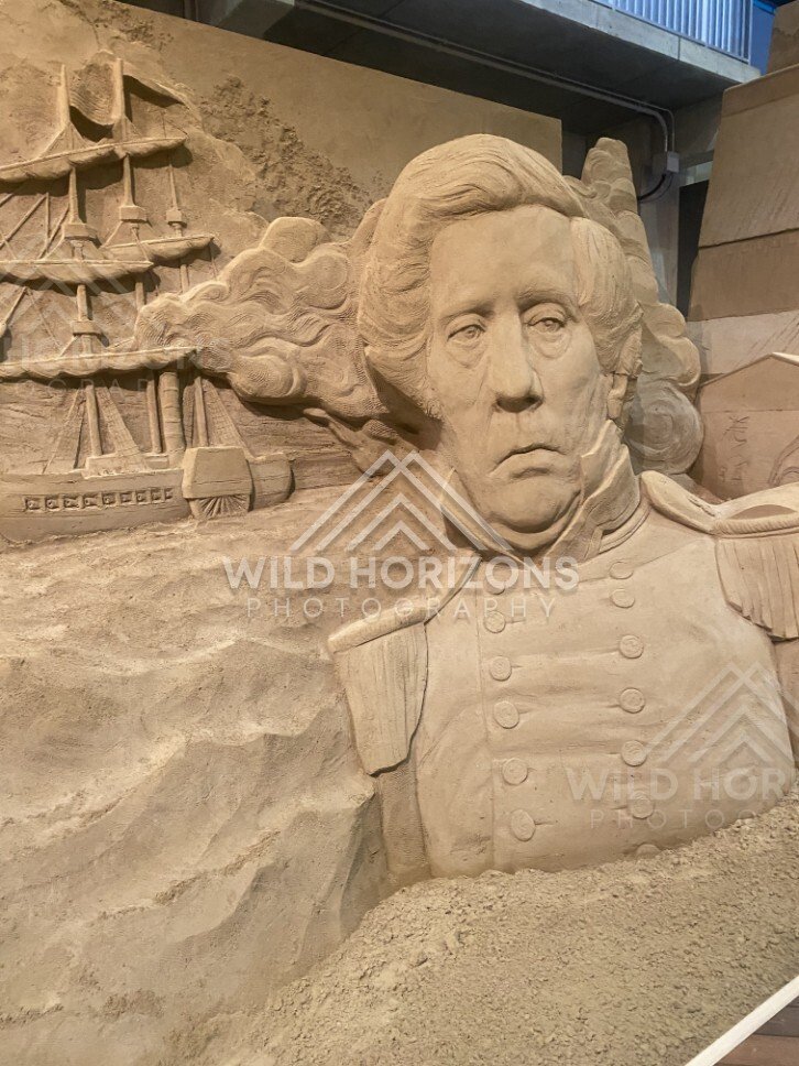 Sand Sculpture Bust of a Naval Officer with Sailing Ship Relief. Tottori Sand Museum, Japan