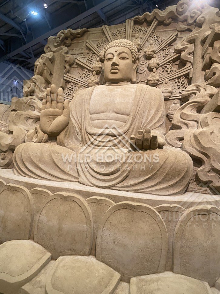 Sand Sculpture of a Seated Buddha with Radiating Halo. Tottori Sand Museum, Japan