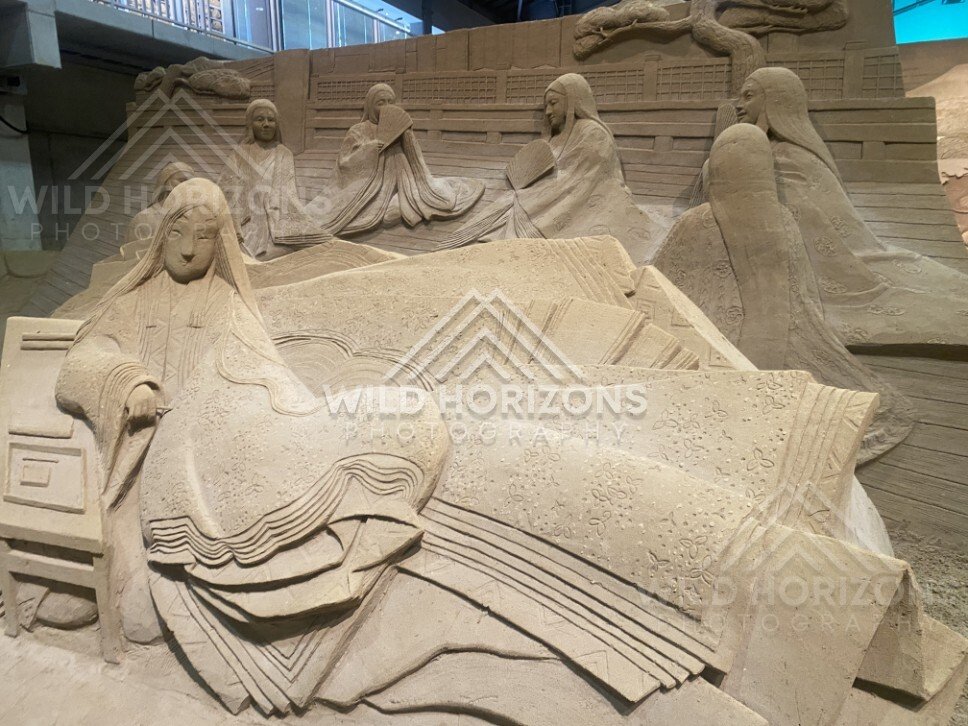 Sand Sculpture Scene of Court Ladies Among Flowing Scrolls. Tottori Sand Museum, Japan