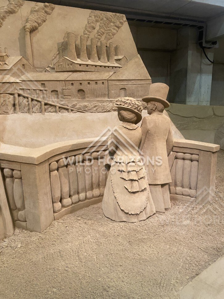 Sand Sculpture of a Victorian Couple Overlooking an Industrial City. Tottori Sand Museum, Japan